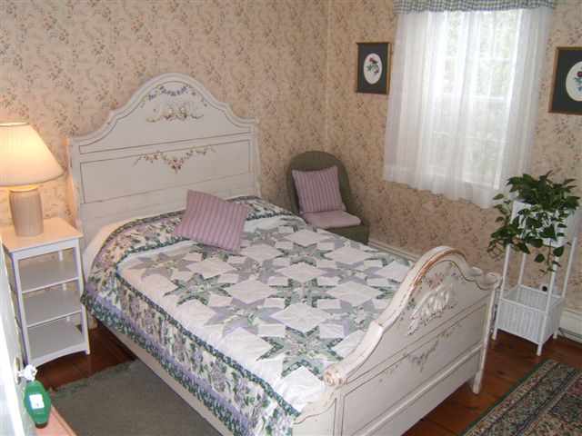 Wellfleet MA lodging accommodations in Room 28, Captains House, Second Floor with Double Bed and Private Bath and 1850's bedset.